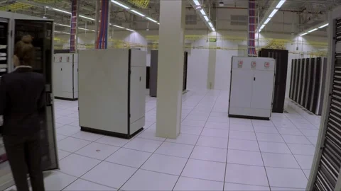 Technician Managing Server Rack Infrastructure Inside Modern Data Center Stock Footage 338132953