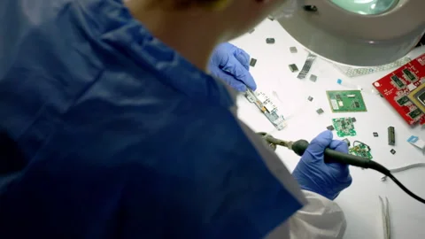 Technician manufacturing mainboard of electronic device Stock Footage 246471846