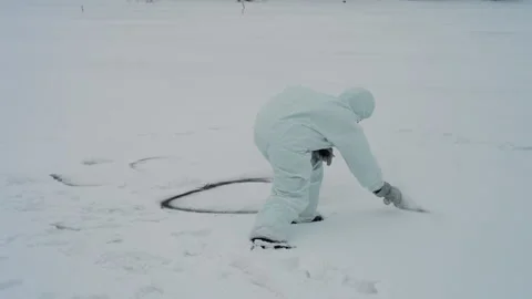 Technician marks perimeter. Snowy ice marks with technician. Overcast winter Video stock 342742972