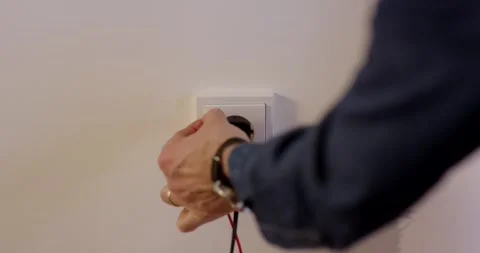 Technician Measuring Voltage at Power Outlet, Electrical Testing, Close Up Shot Stock Footage 341327186