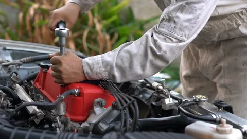 The technician mechanic checking engine and repair Stock Footage 107594040