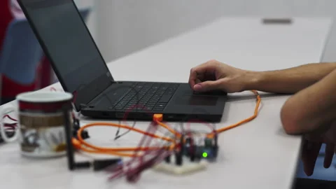 Technician methodically troubleshoots laptop problems Stock Footage 273032944