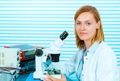 Technician with microscope, portrait Stock Photos