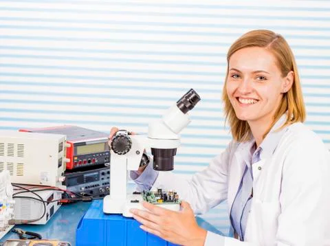 Technician with microscope, portrait Stock Photos