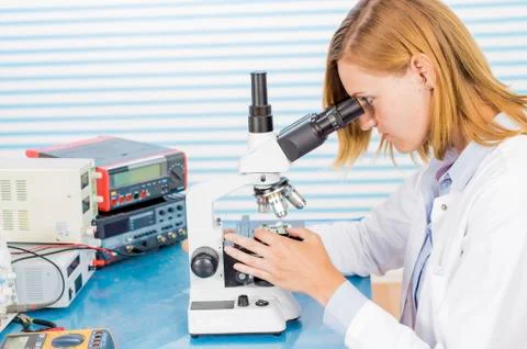 Technician with microscope, portrait Stock Photos