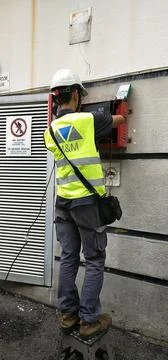 Technician from M&amp;M Electrical &amp; Engineering performing work Stock Photos