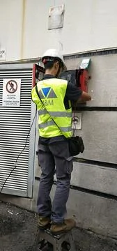 Technician from M&amp;M Electrical &amp; Engineering performing work Stock Photos