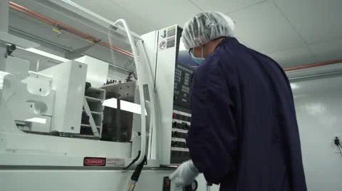 Technician observes control panel in cleanroom Stock Footage 10895608