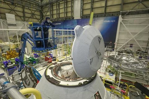 A technician observes the functional test of the NASA Docking System (NDS) .. Stock Photos