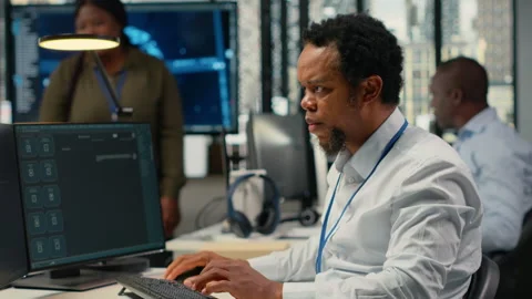 Technician in office solving tasks with artificial intelligence LLM chatbot Stock Footage 323332238