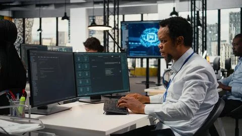 Technician in office solving tasks with artificial intelligence LLM chatbot Stock Photos