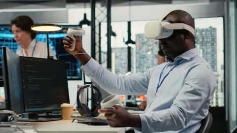 Technician in office using VR headset equipment to accelerate AI calculations Video stock 323238132