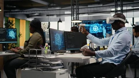 Technician in office using VR headset equipment to accelerate AI calculations Stock Photos