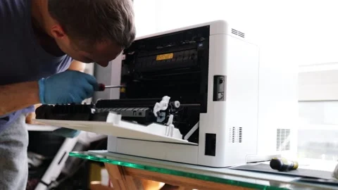 Technician open cover printer fix repair problem and cleaning transfer belt Stock Footage 287505315