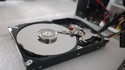 A technician opening a hard disk  while the HDD is reading data. Stock Footage 328798913