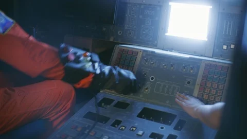 Technician operating control board in cockpit Stock Footage 108959476