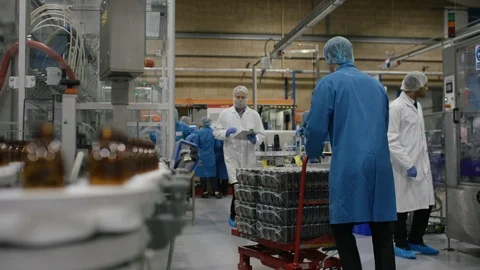 Technician operating control board near production line in cosmetic factory Video stock 107981295
