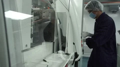 Technician operating control panel in cleanroom Stock Footage