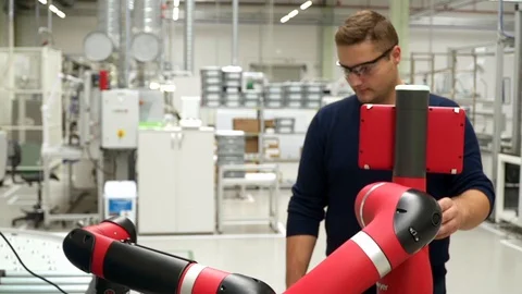 Technician Operating Robotic Hydraulic Arm By Remote Vídeos de archivo 127824931