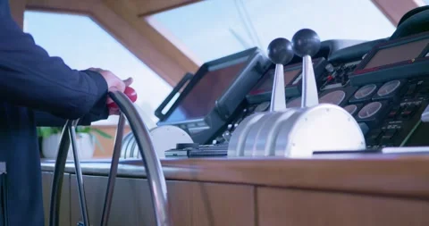 Technician Operating Yacht Steering in Control Room Видео 323752391