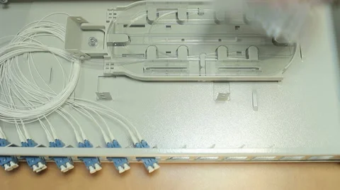 A technician with optical connector Stock Footage 58801202