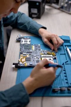 Technician or Engineer installing CPU microprocessor to motherboard socket. top 写真素材