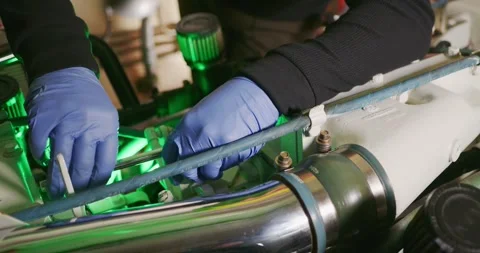 Technician Performing Engine Maintenance in the Engine Room Stock Footage 323739840