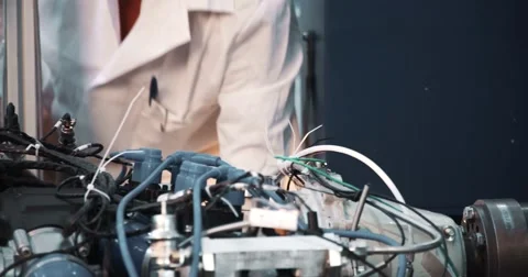 A technician performing periodic engine maintenance Video stock 52928345