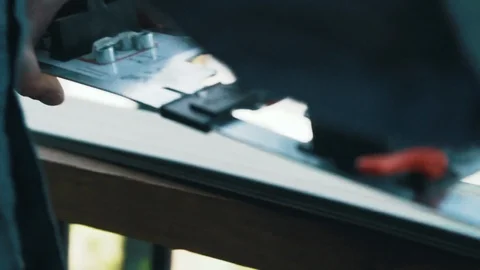Technician placing binding mounting jig on skis Stock Footage 96518644
