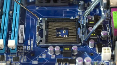 Technician plug in CPU microprocessor to motherboard socket Stockbeeldmateriaal 61640558