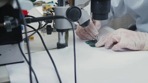 Technician plug in CPU microprocessor to motherboard socket Stock-Footage 70050452