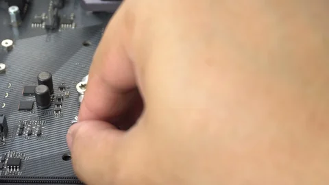 Technician plug in CPU microprocessor to motherboard socket. Video stock 128406637