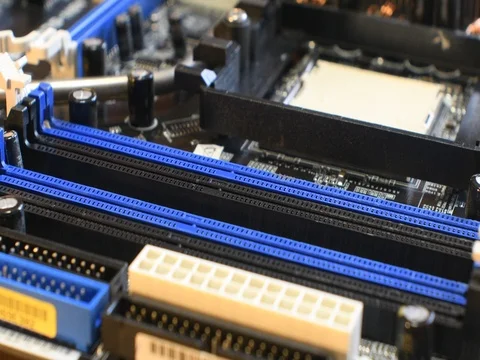 Technician plug in a RAM Module on a motherboard socket. Stock Footage 80535483