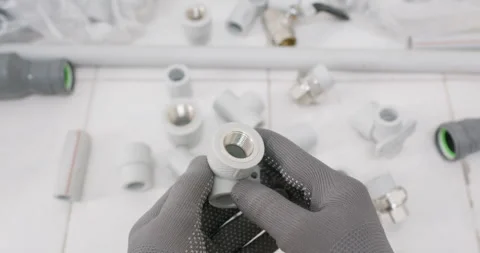 Technician points inside adapter and confirms thread pitch 動画素材 322007941