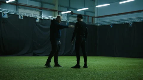 Technician preparing an actor for motion capture, placing markers over suit Stock Footage 166022846