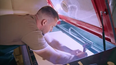Technician preparing material for laser engraving machine Stock Footage 308931597