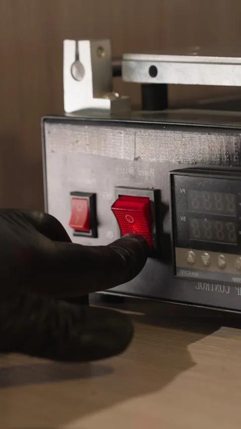 Technician Pressing Power Switch on Temperature Control Device in Lab Stock Footage 310490759