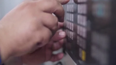 Technician programming with keyboard a  cnc machine slow motion 库存影片 79066858