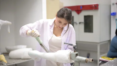 Technician of prosthetic factory fixing prosthetic device in workshop Stock Footage 241525751