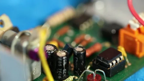 Technician pulls a chip from the circuit board. macro shooting Stock Footage 72583007