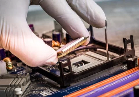 The technician is putting the CPU on the socket of the computer motherboard Stock Illustration