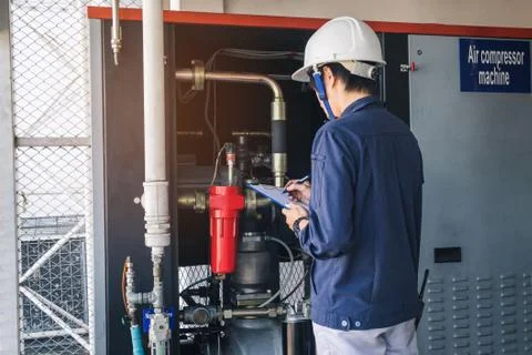 Technician is recording data Voltage or current in control panel of power p.. Stock Photos