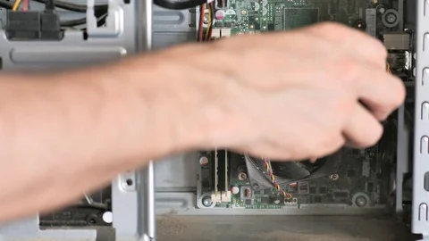 Technician removes dust from inside a pc Stock Footage 116999208