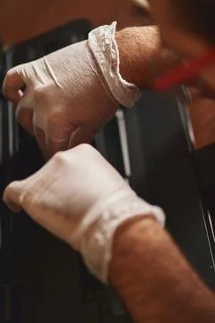 Technician removes part from printer Stock Photos
