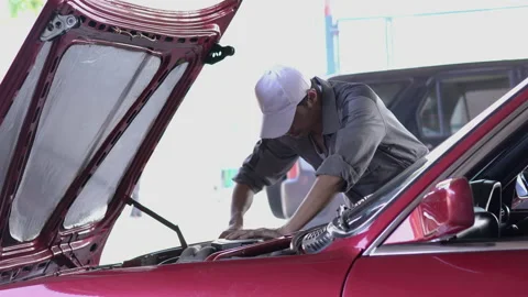 Technician repair engine car Stock Footage 173593430