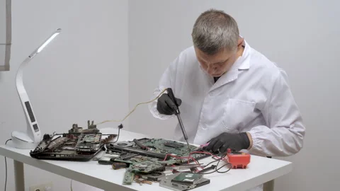 Technician Repairing Computer Circuit Boards Stock Footage 313494813