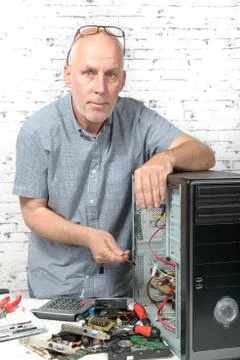 A technician repairing a computer Stock Photos