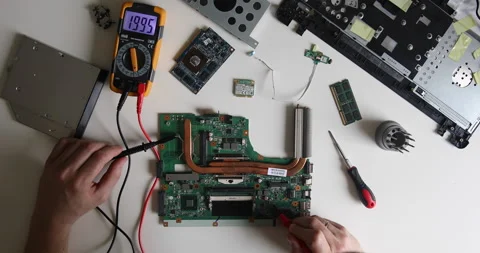 Technician repairing a computer. Work in the service center. Computer repair Stock Footage 153394109
