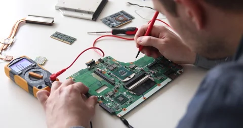 Technician repairing a computer. Work in the service center. Computer repair Stock Footage 153394693