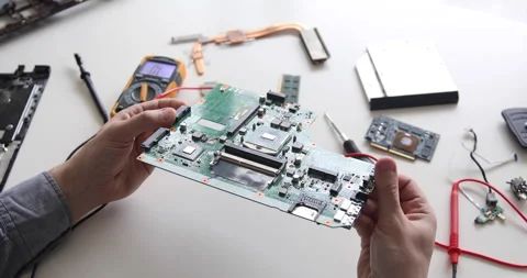 Technician repairing a computer. Work in the service center. Computer repair Stock Footage 153398485